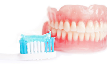 dentures with toothbrush