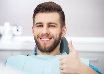 Thumbs up in dental chair