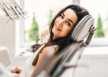 woman happy in dental chair