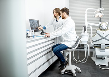 Dental team members reviewing X-ray together