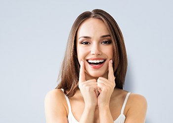 woman showing off dental bridge in South Windsor