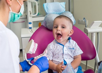 Young toddler getting a dental exam