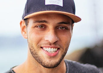 Man in baseball cap smiling