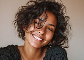 Portrait of beautiful young woman with healthy teeth