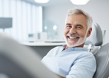 Smiling senior woman in dental chair