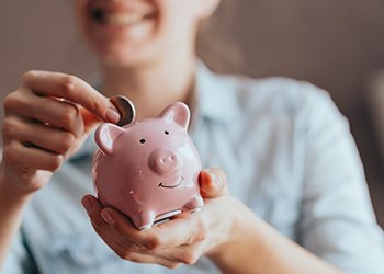 piggy bank representing cost of dentures in South Windsor