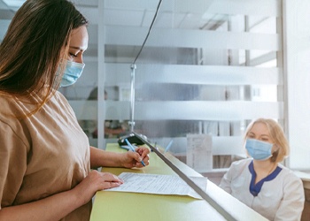 Female dental receptionist in South Windsor