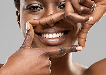 woman framing healthy white teeth 