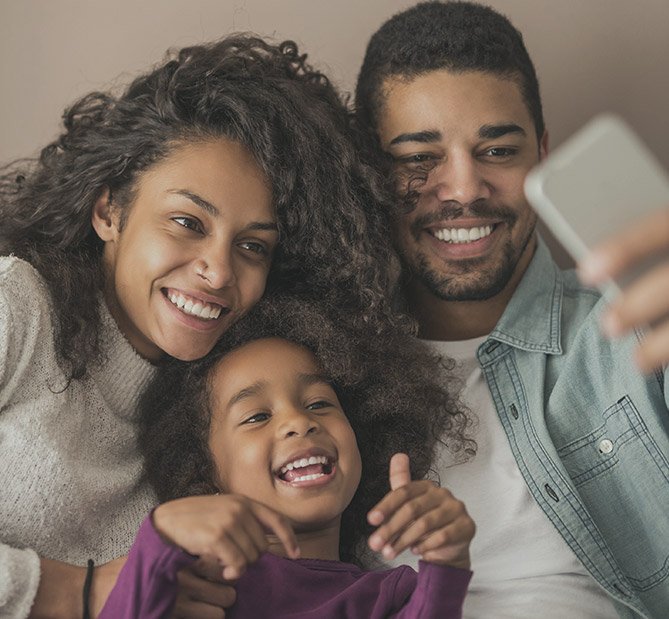 Happy family of three taking a selfie