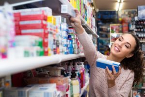 woman wonders how to choose toothpaste in South Windsor